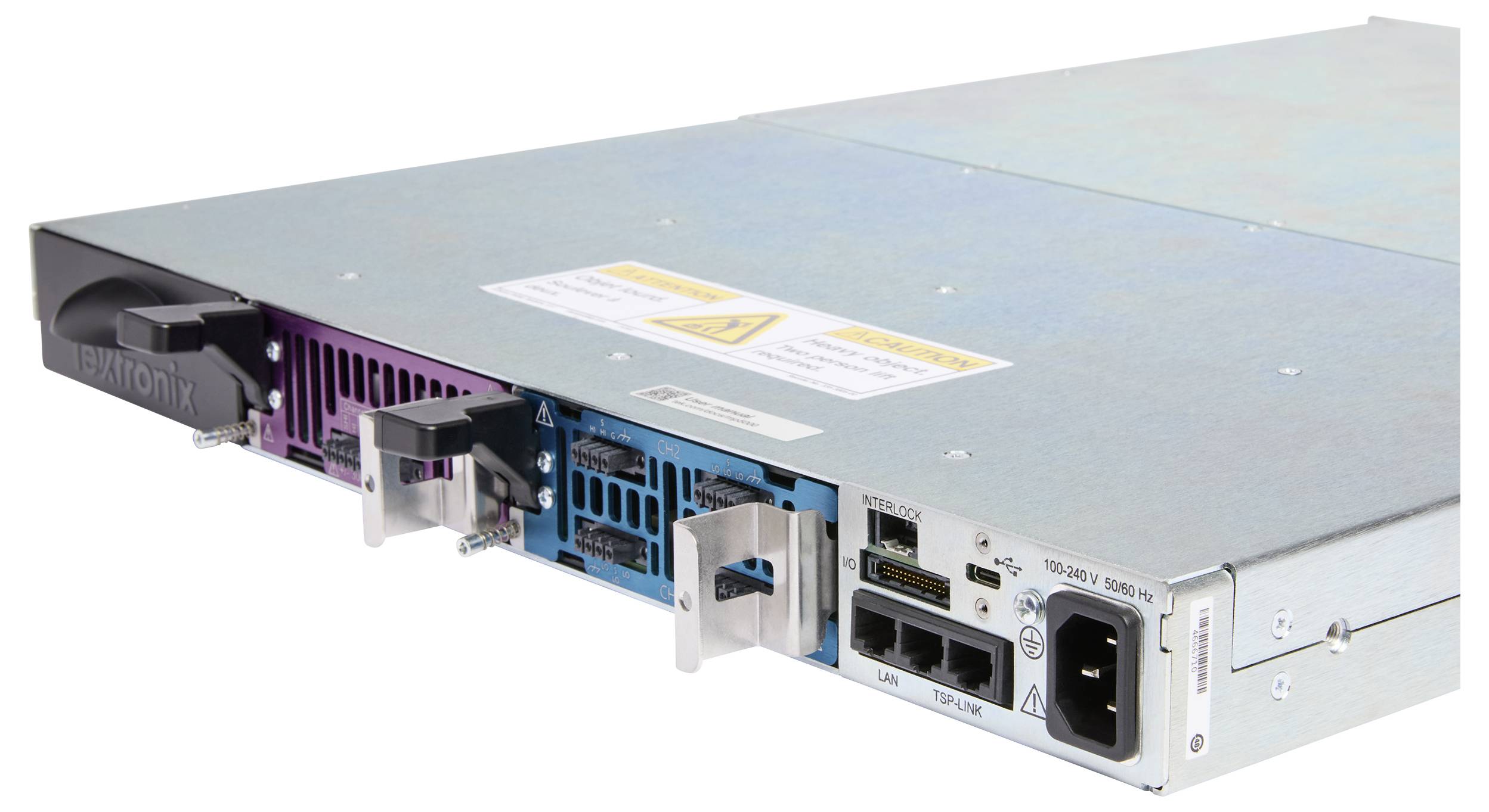 A metal server with multiple ports and ventilation grilles, displaying a caution label, indicating network and power connectivity options.