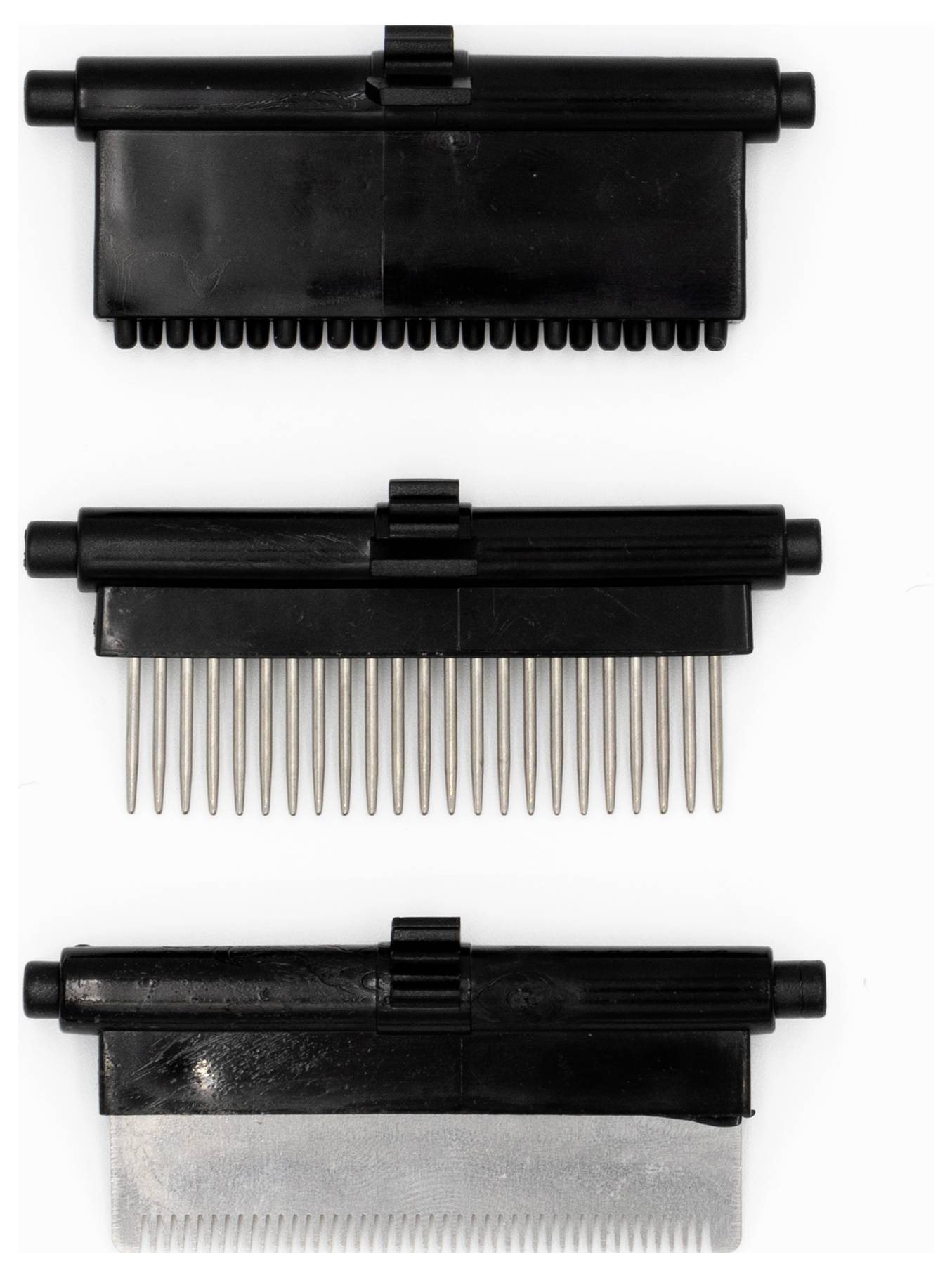 Three interchangeable black and gray grooming clipper blades, shown detached, with one having straight metal teeth, for pet grooming.