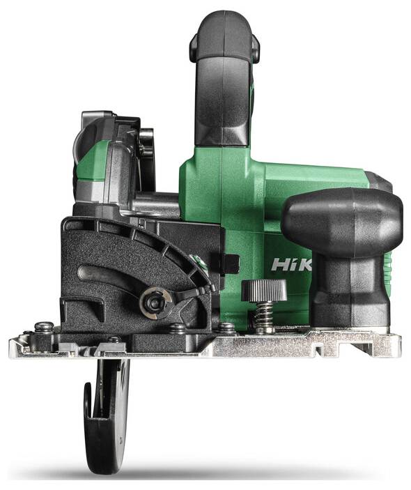 A green and black electric circular saw viewed from the front, showing the blade and handle.