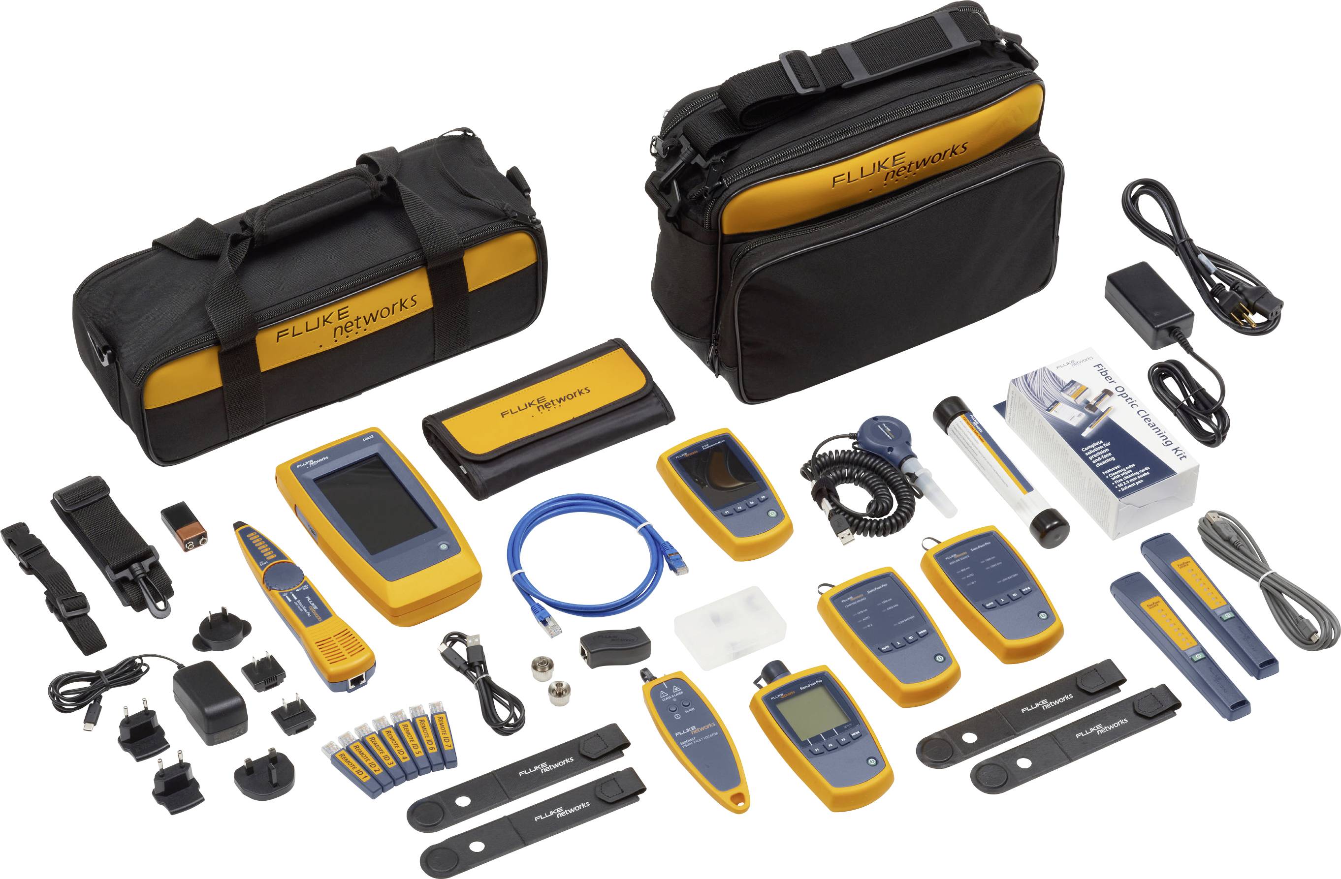 A collection of Fluke Networks testing equipment, including various hand-held devices, cables, chargers, accessories, and carrying cases.