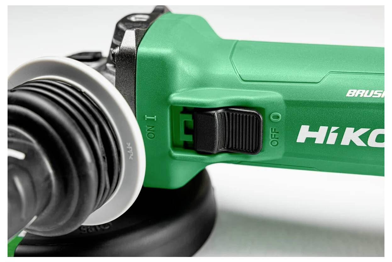 A close-up of a green power tool with a black switch labeled ON and OFF, partially showing the brand name alongside the switch.