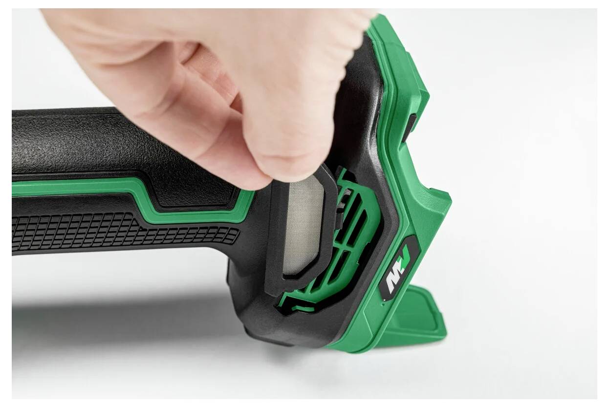 A hand adjusting a green and black power tool, highlighting the ergonomic grip and control button.