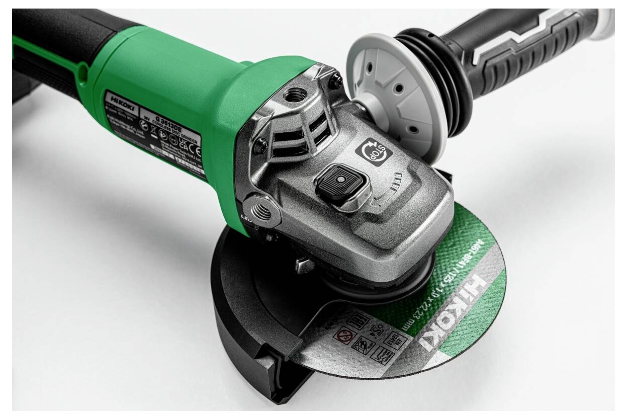 An angle grinder with a green handle and a circular cutting disc is shown, displaying the brand name on the disc.