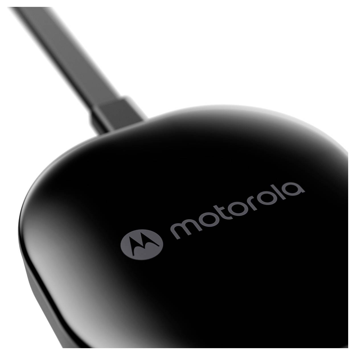 A close-up view of a black Motorola streaming device's smooth, glossy surface with the Motorola logo visible on top.