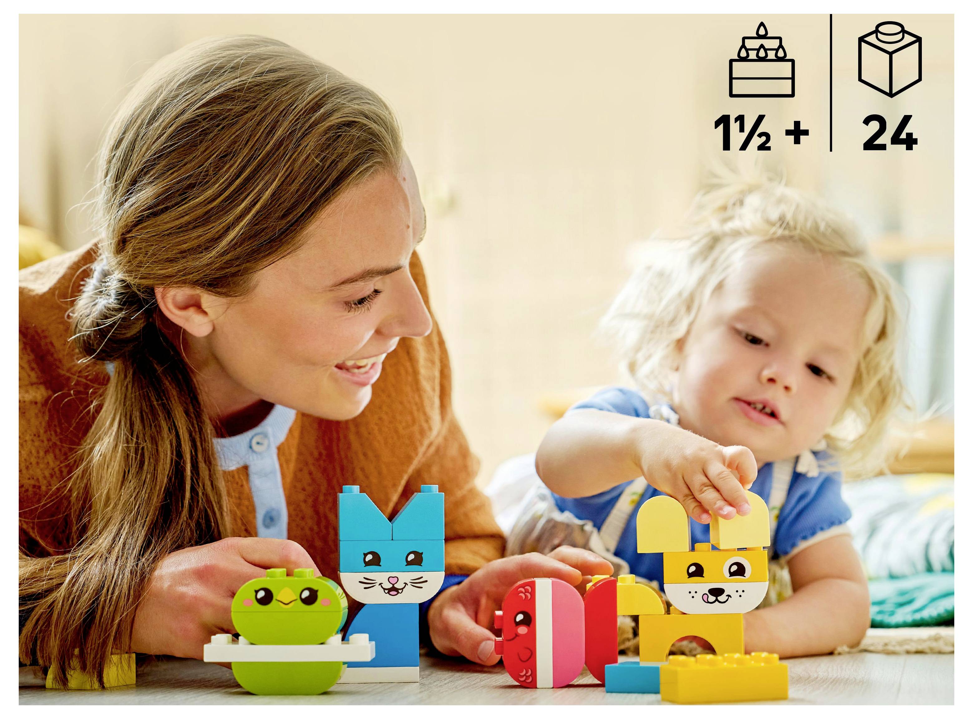 A woman and child play with colorful animal-themed building blocks. Icons show age recommendation of 1½+ and a set with 24 pieces.