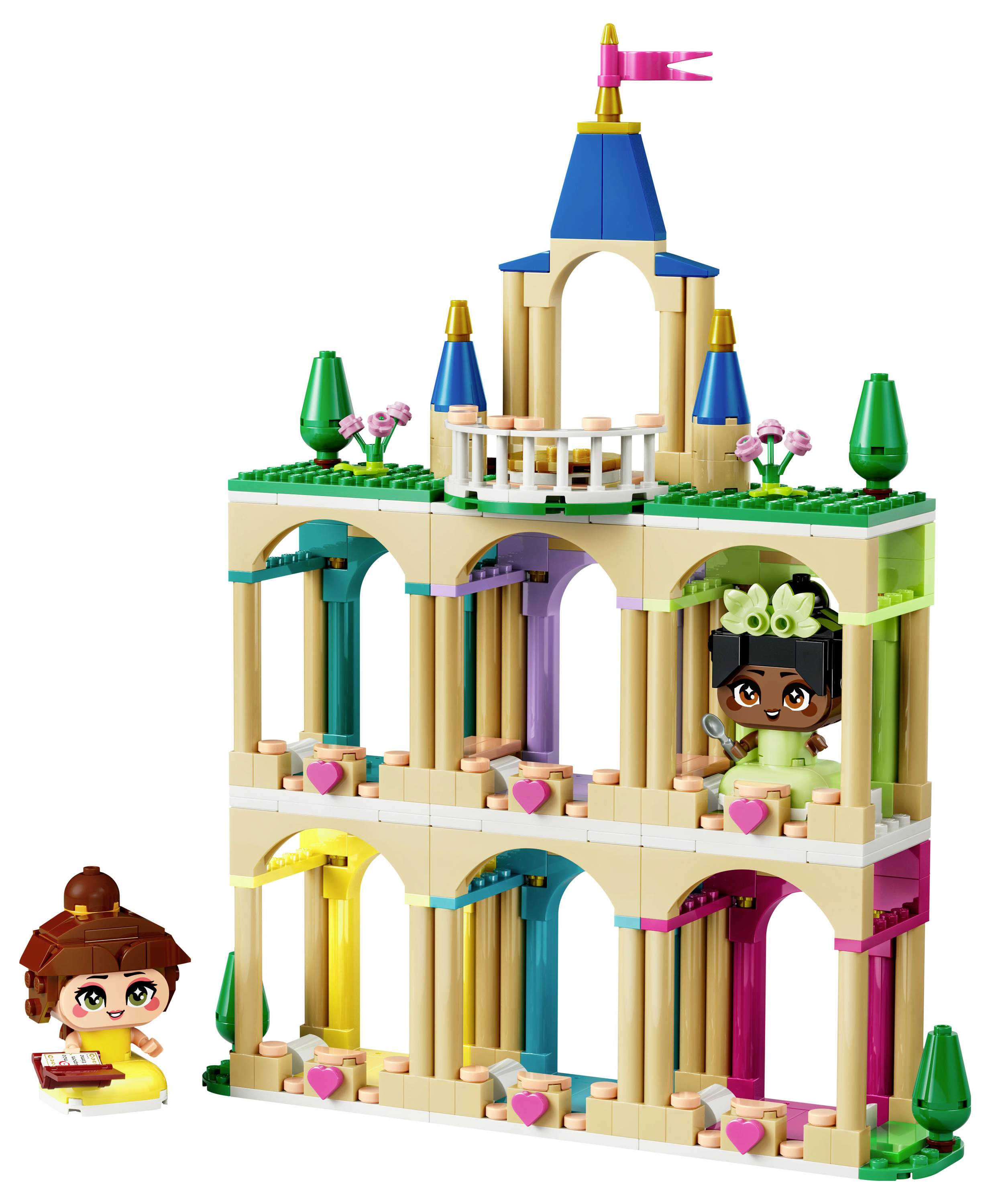 Two toy figures with a colorful, multi-level building made from bricks, each level featuring arches and a flag on top.