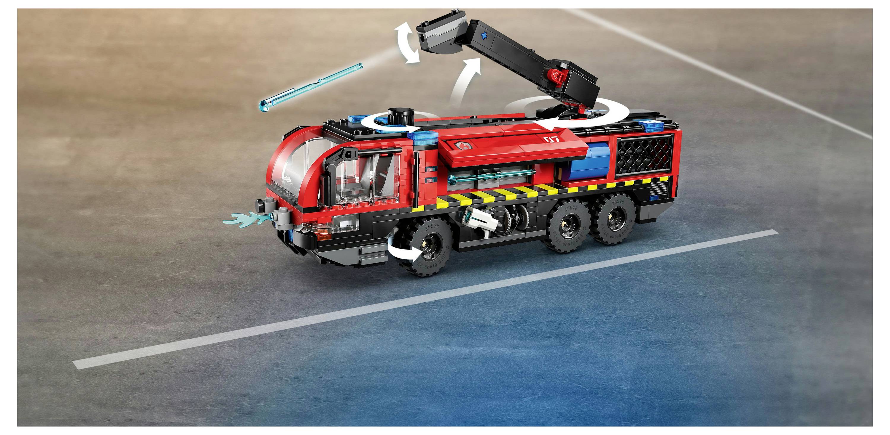 A red and black toy fire truck with extendable arm and arrow indicators showing rotation and motion directions on a gray surface.