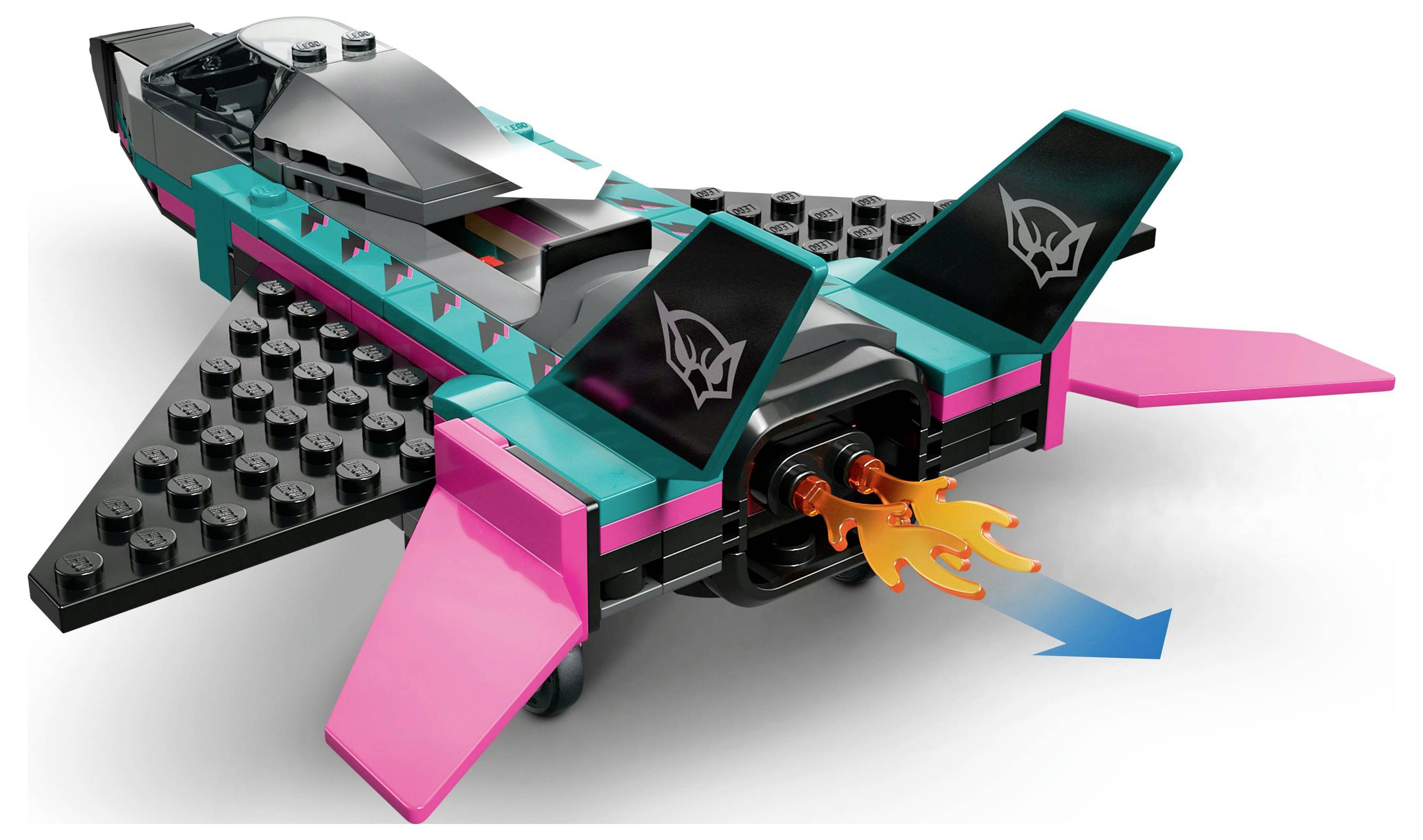 A colorful toy spaceship model with black, pink, and teal elements. Flames are shown at the rear, indicating forward movement.