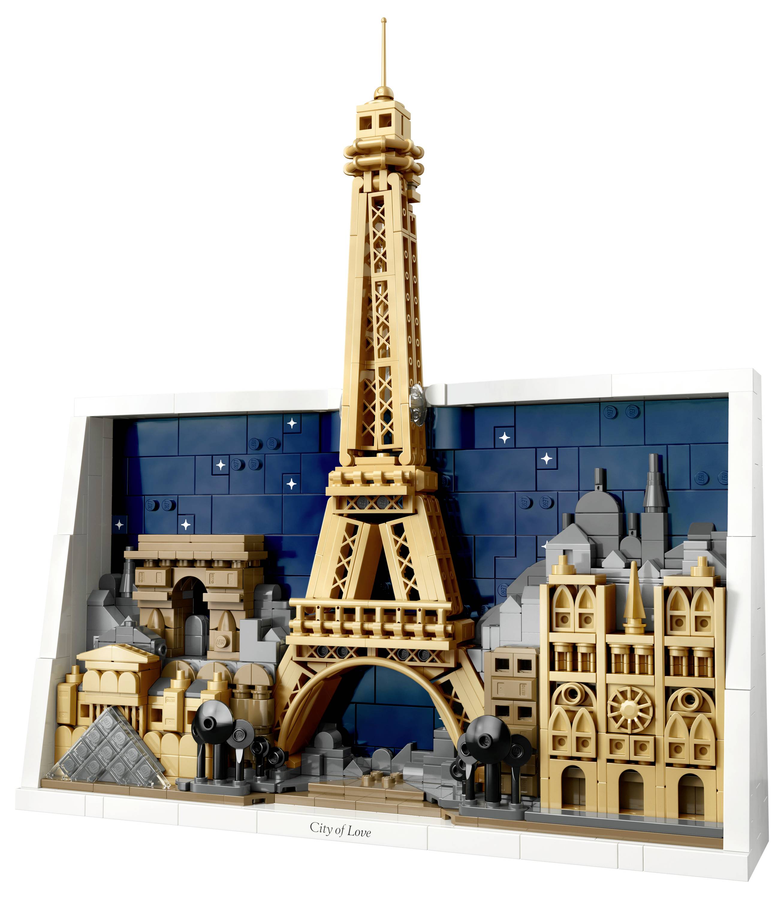 Lego model of Paris skyline featuring Eiffel Tower, Arc de Triomphe, and other landmarks against a night sky background.