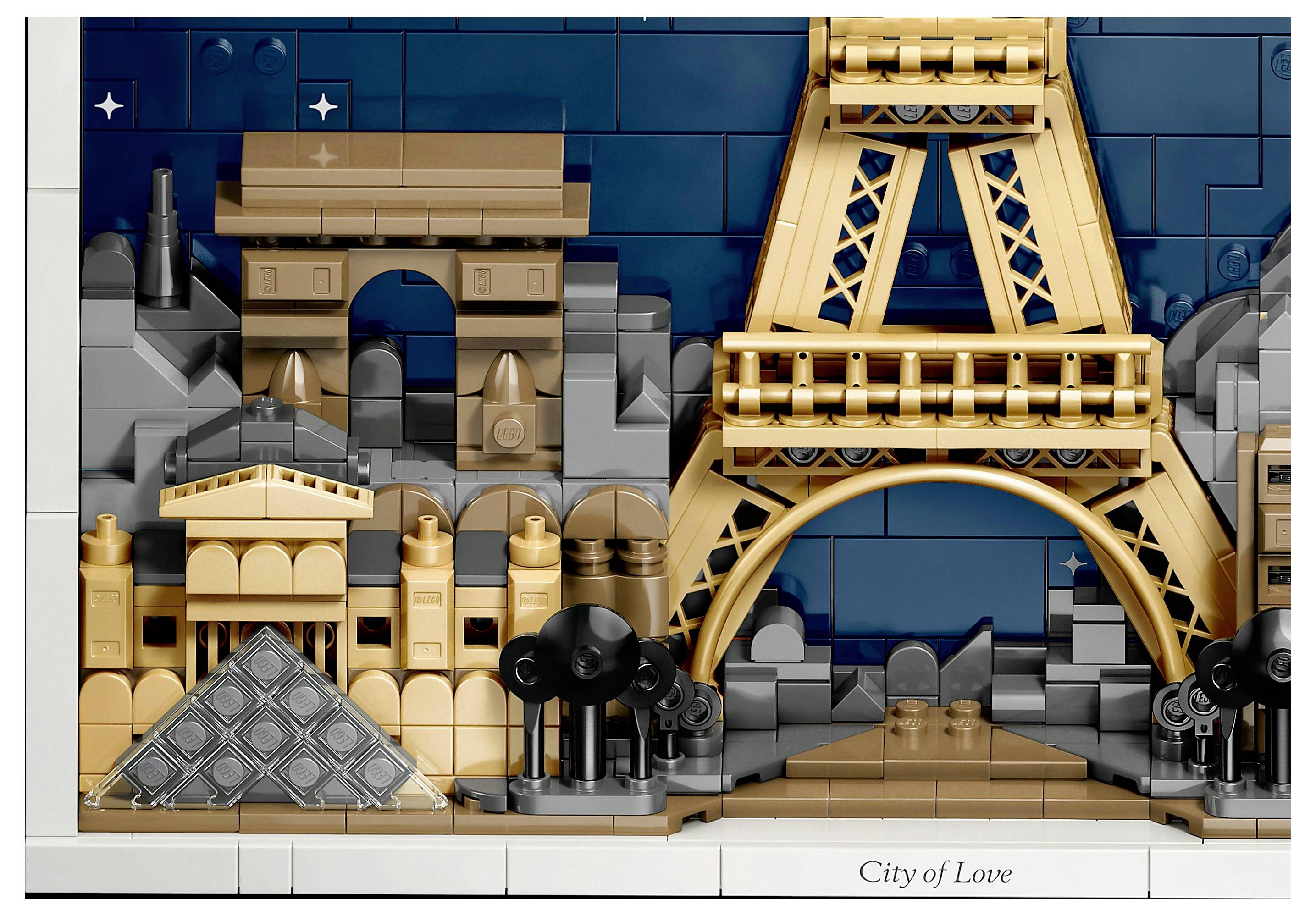 A detailed LEGO model depicting iconic Paris landmarks, including the Eiffel Tower and Arc de Triomphe, set against a starry night sky.