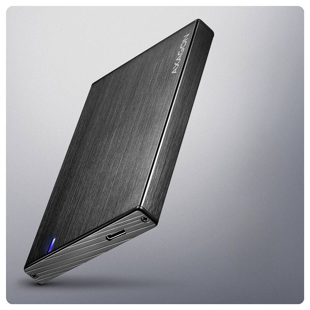 A sleek, black external hard drive with a blue LED indicator on its corner, shown against a gradient gray background.