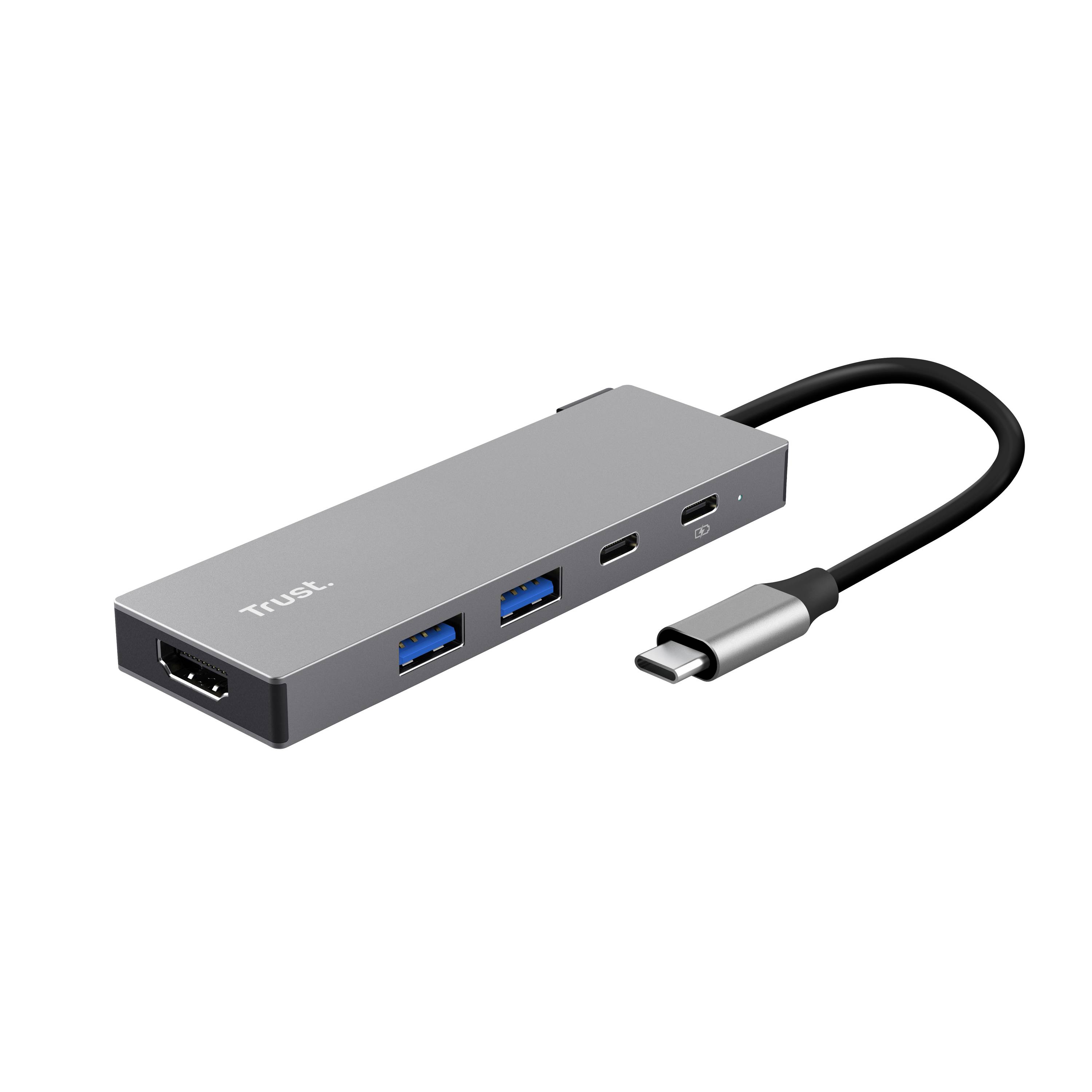 A rectangular USB-C hub with an attached cable, featuring ports for HDMI, USB-C, and three USB-A connections, labeled 'Trust'.