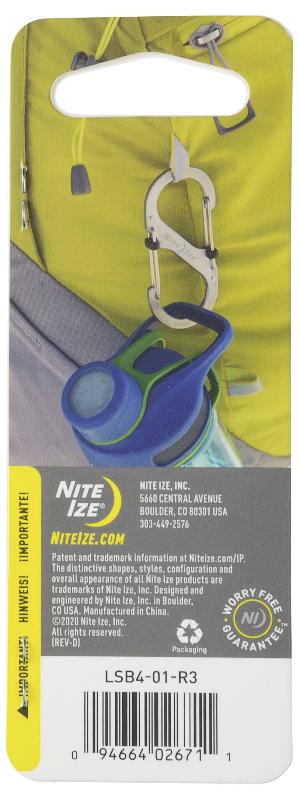 'TagLit Magnetic LED Marker' attached to a backpack, with contact details for Nite Ize, Inc. at the bottom, resting on a yellow fabric.