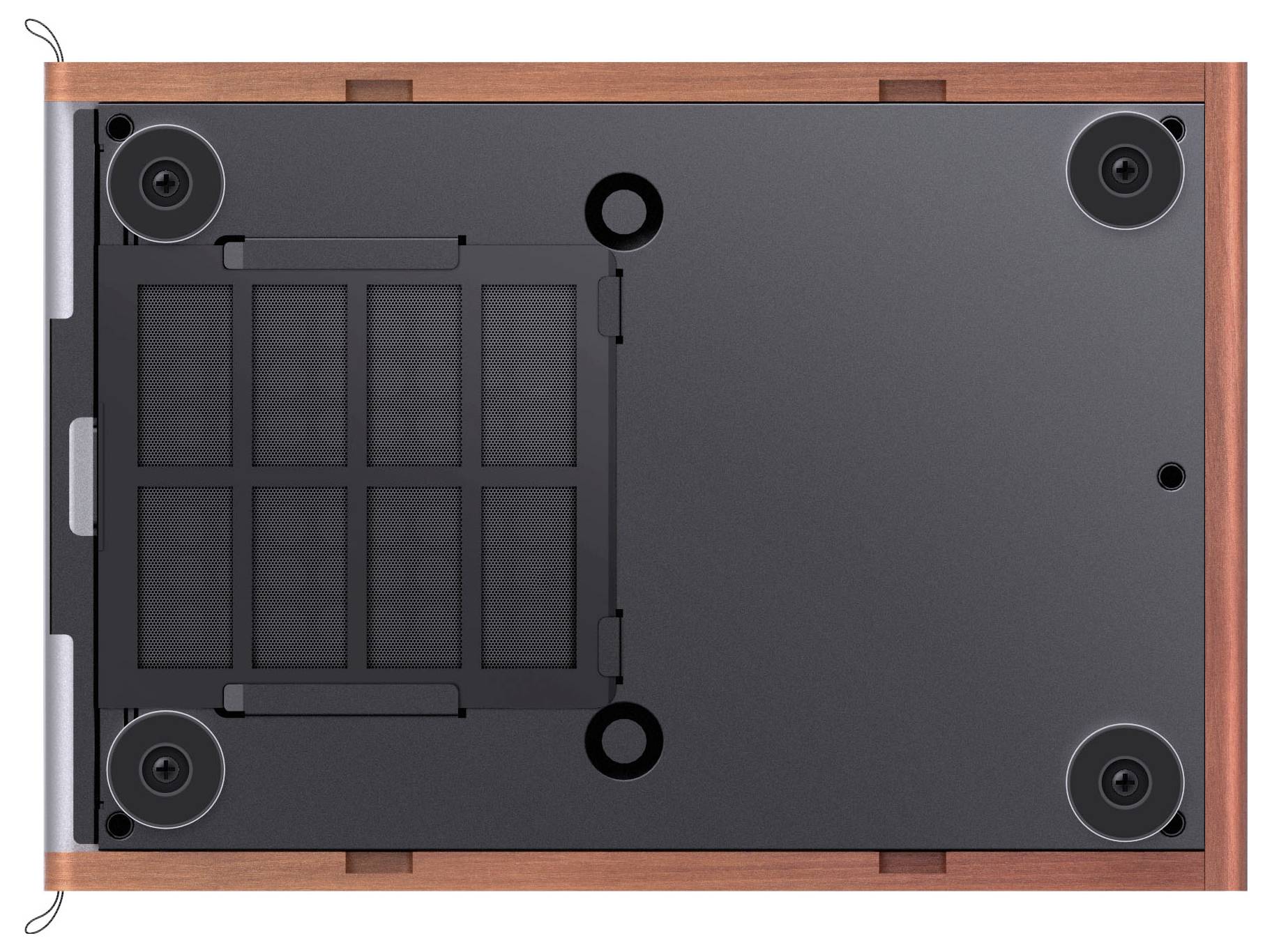 The image shows the bottom view of a device with a wooden frame, four rubber feet, and a central ventilation grid.