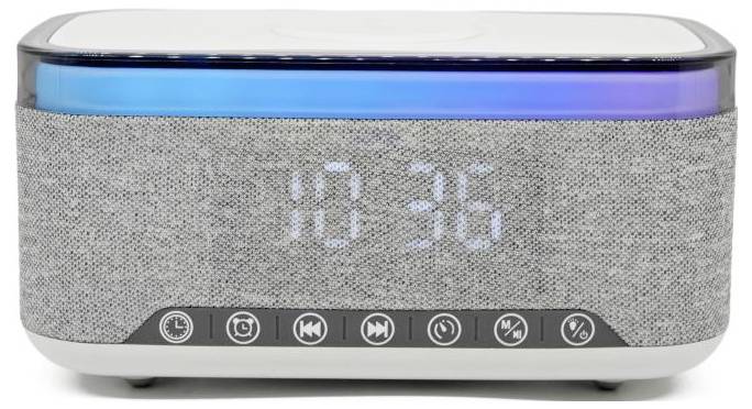 A digital alarm clock with fabric front, displaying '10:30'. Features buttons for various functions below the display.