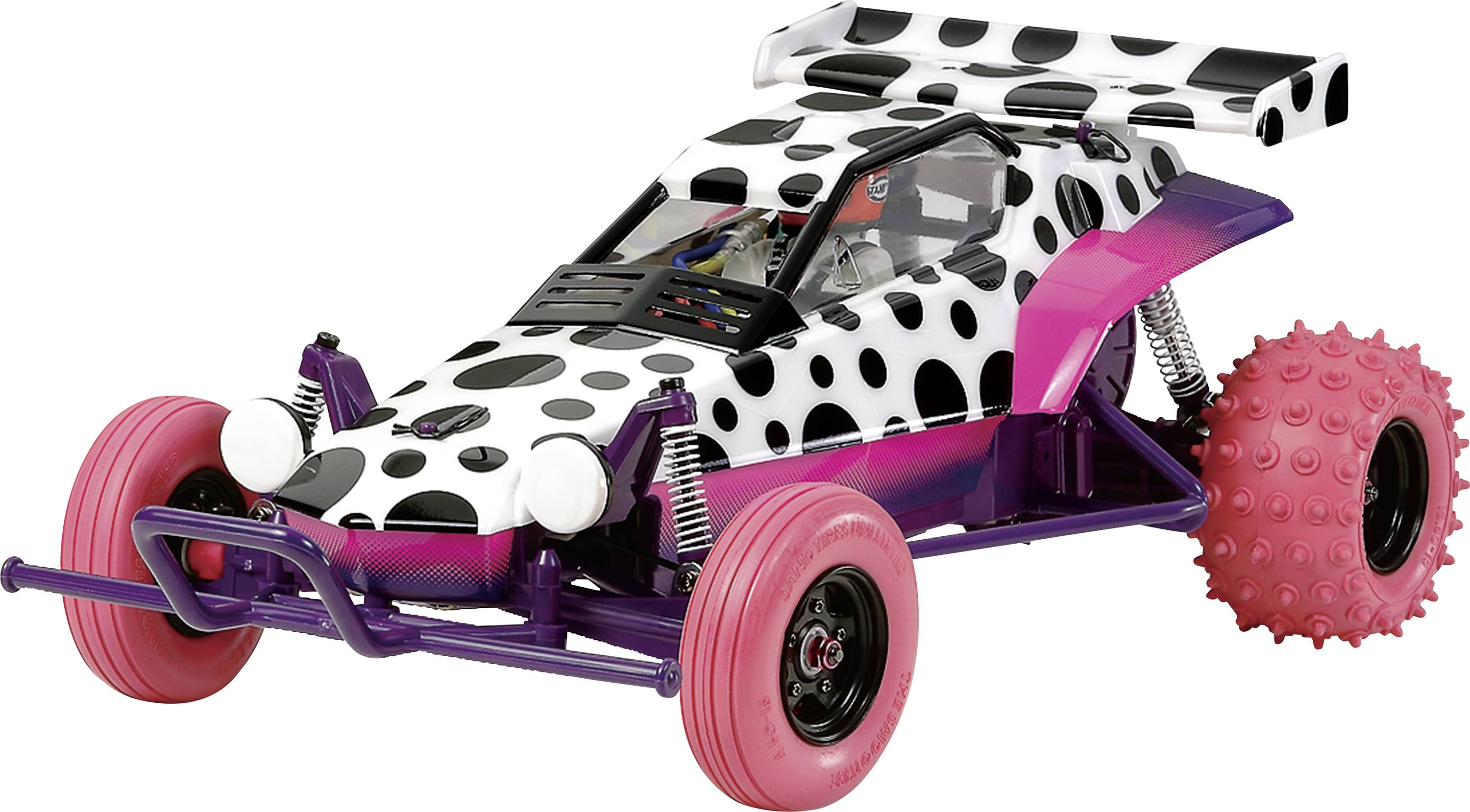 A remote-controlled dune buggy with a polka dot pattern, pink and purple accents, and large knobby pink rear wheels, displayed against a white background.