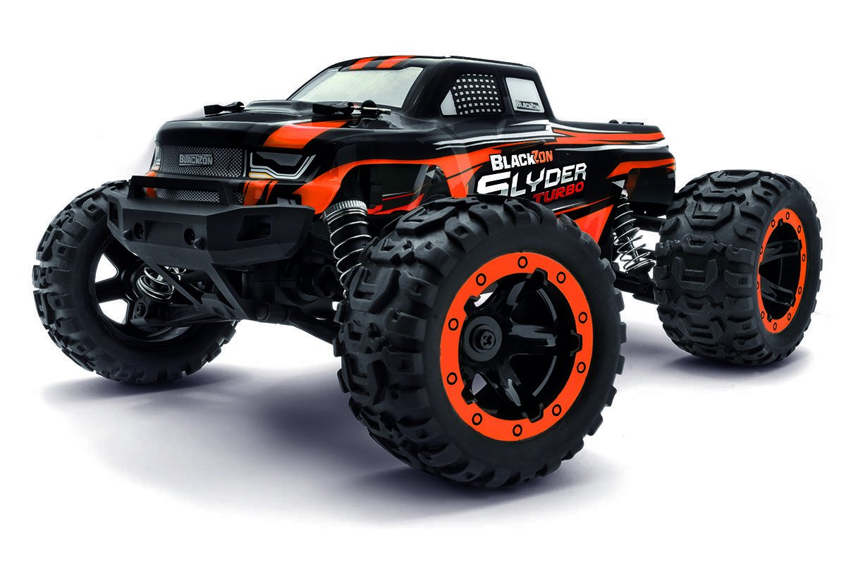 A remote-controlled, black and orange toy truck with oversized tires, labeled 'Blackzon Slyder Turbo', shown from a front-side angle.