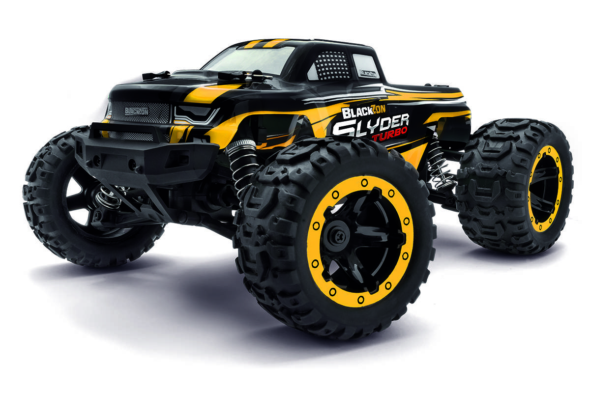 A black and yellow remote control monster truck with large tires, labeled 'Blackzon Slider Turbo', against a white background.