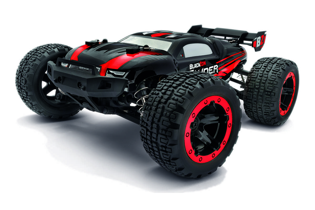 A black and red remote-controlled monster truck toy with large, treaded tires and a sleek design, positioned at an angle.