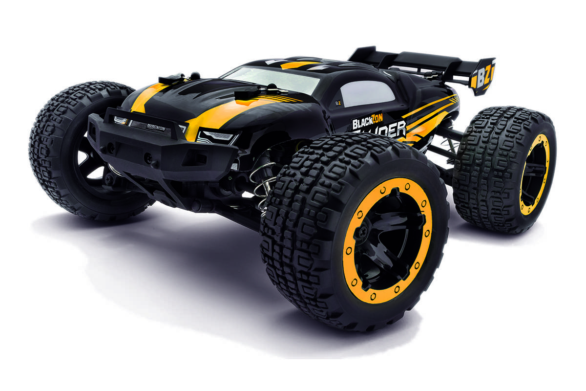 A black and yellow remote control truck with large, rugged tires and sporty design, displayed on a white background.
