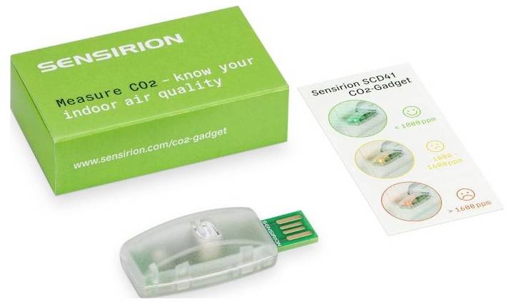 A green box labeled 'Measure CO2 - know your indoor air quality' with a clear USB device and a card showing CO2 levels with smiley faces.