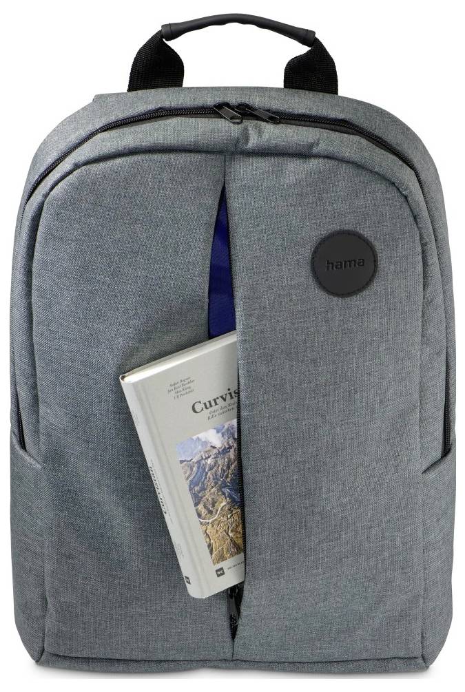 A gray backpack with a front zipper pocket containing a book titled 'Curves,' featuring a mountain landscape on the cover.