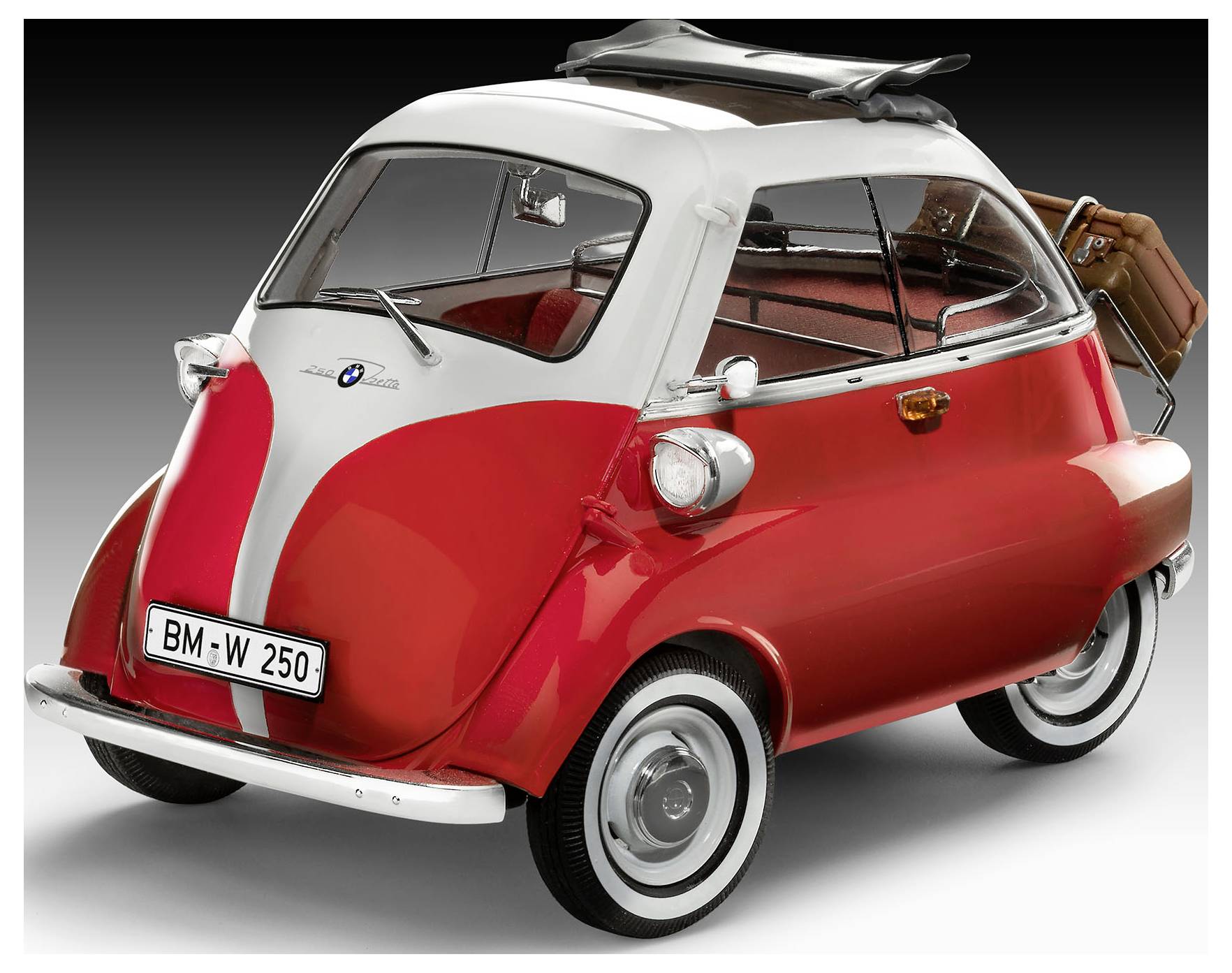 A classic, red-and-white microcar with a sunroof, featuring a small luggage rack holding a suitcase on the rear, against a gray background.