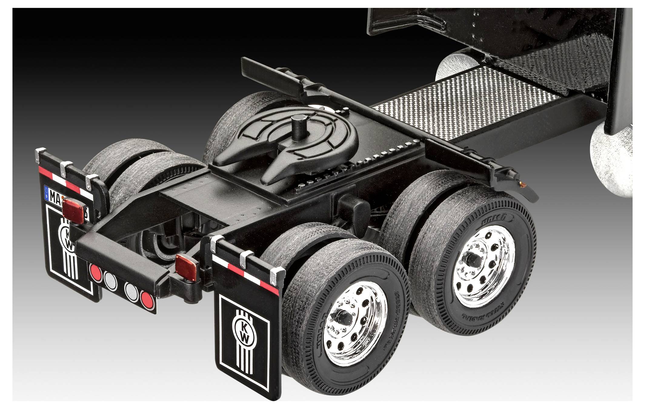 A detailed image of a truck's rear axle area showing the mud flaps, tires, and hitch components, showcasing heavy-duty vehicle features.