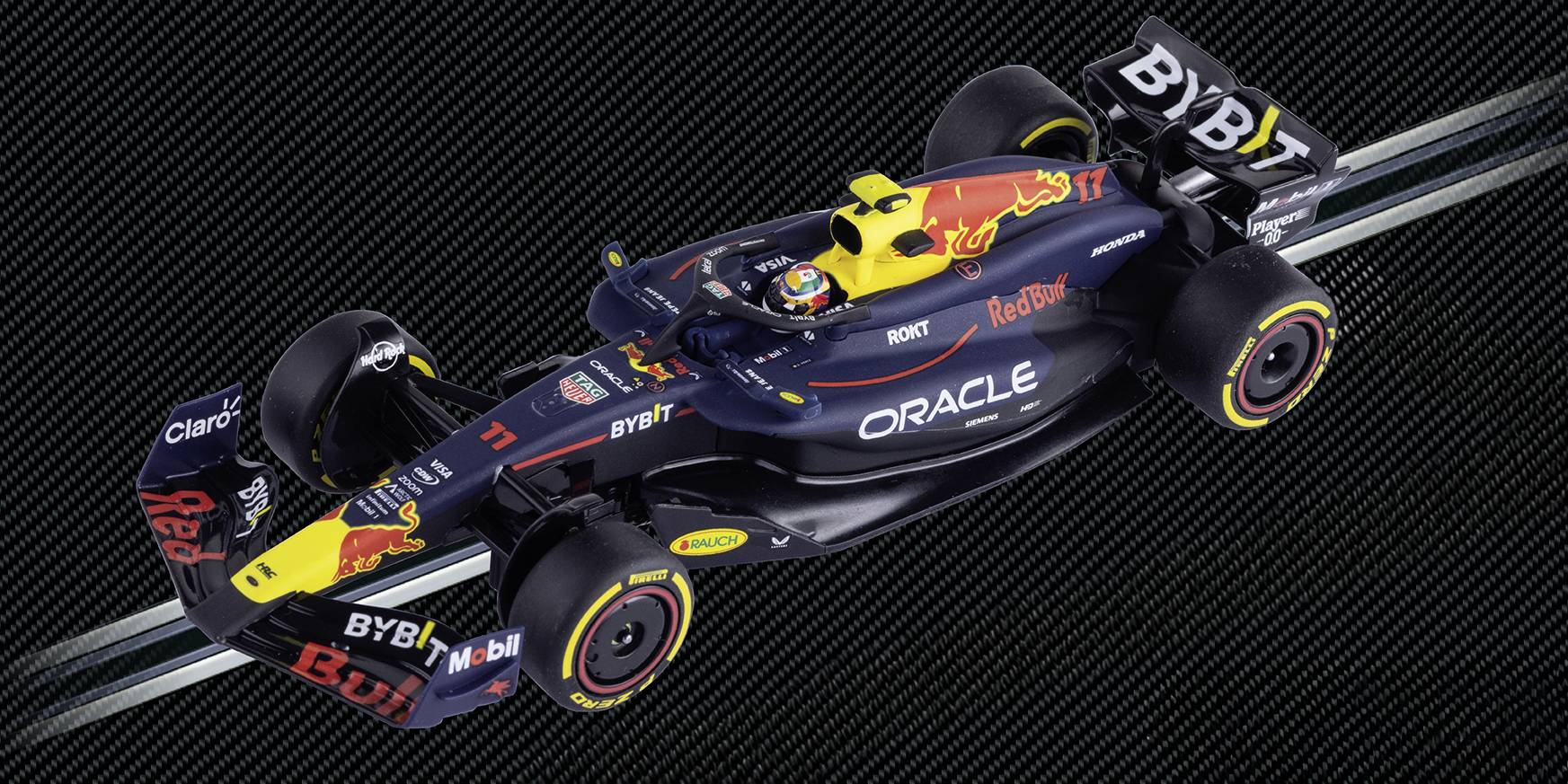 A Formula 1 race car with a sleek black design, featuring prominent logos like 'Oracle' and 'Red Bull Racing,' on a dark background.