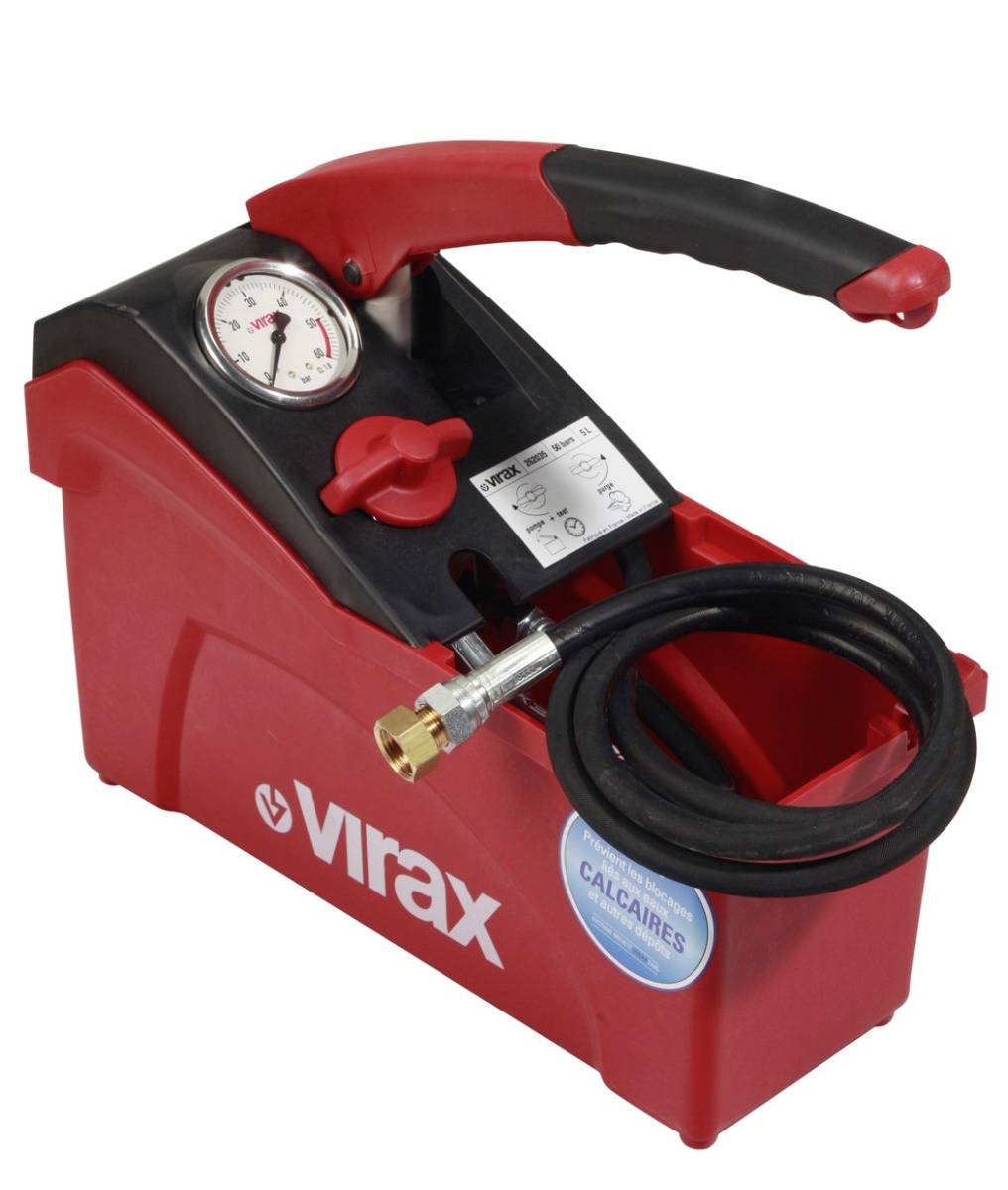 Red Virax pressure testing pump with gauge, hose, and handle, used to test plumbing systems.