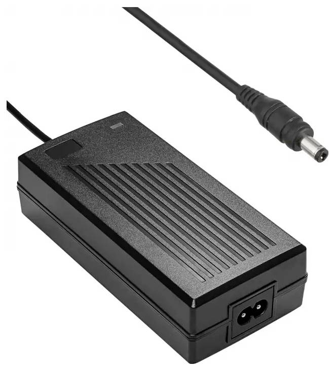 A black power adapter with a two-prong plug and a connected cable ending in a round tip.