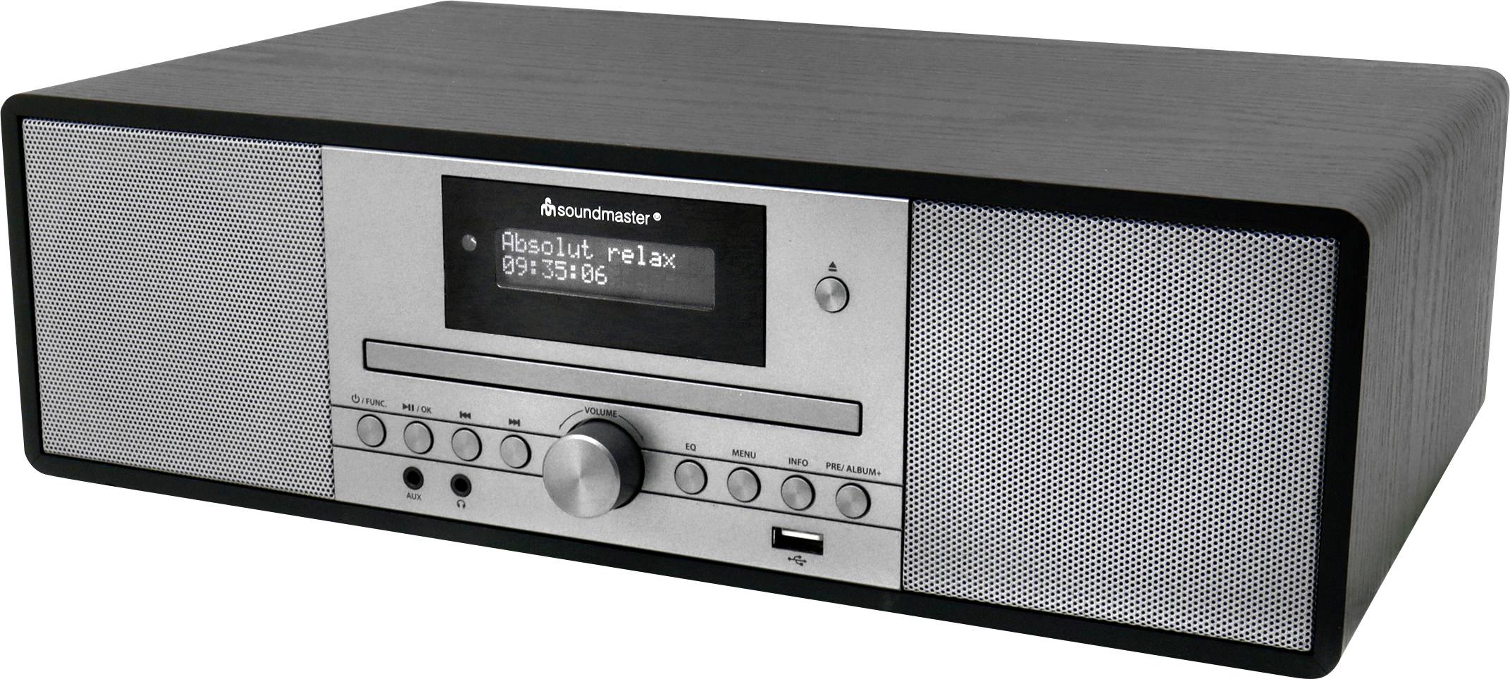 A rectangular black and silver radio with a digital display showing 'Absolut relax' and frequency '99.35'. Features knobs and buttons.
