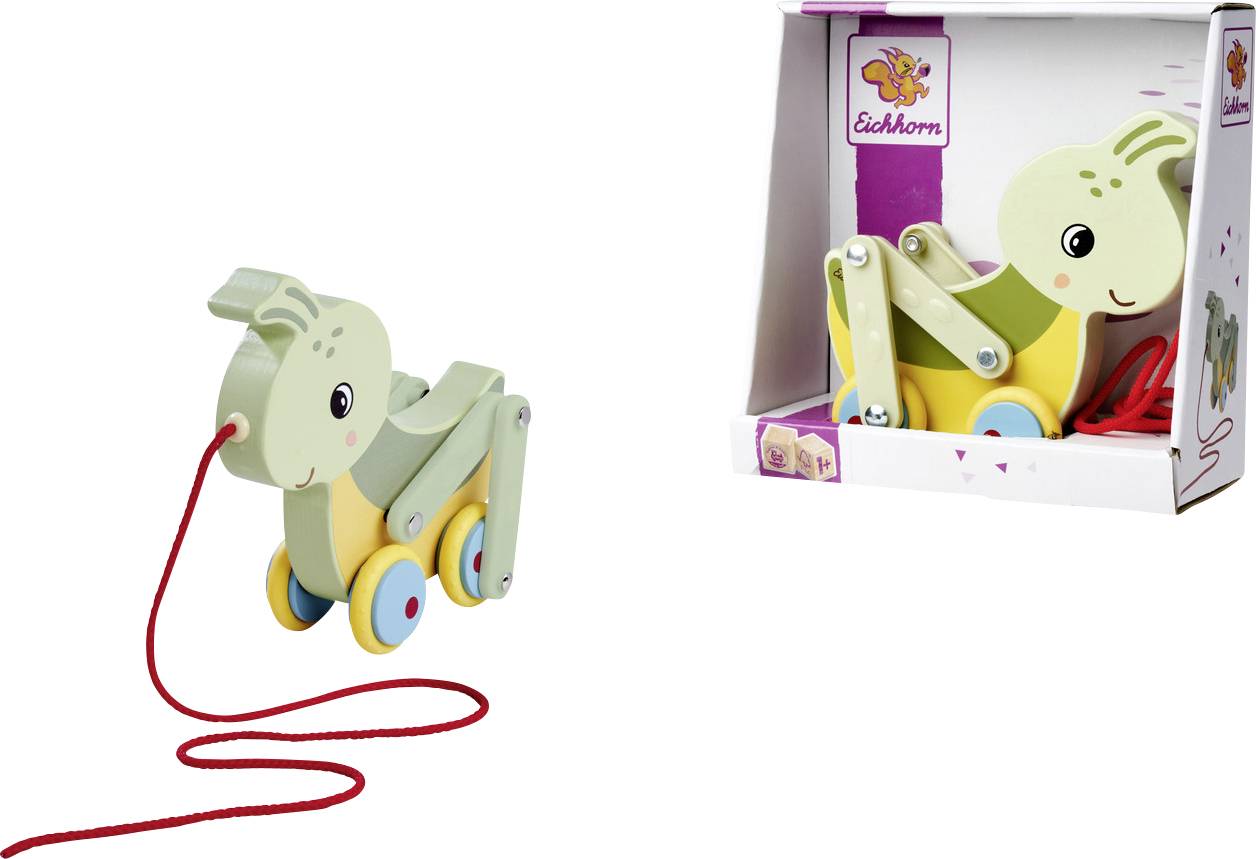 A wooden pull toy shaped like a green rabbit with wheels and a red string, shown next to its packaging featuring the same design.
