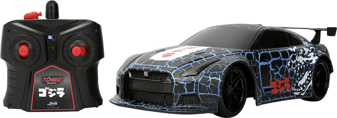A black and blue remote-controlled car with a spoiler, featuring a matching black controller with red buttons.