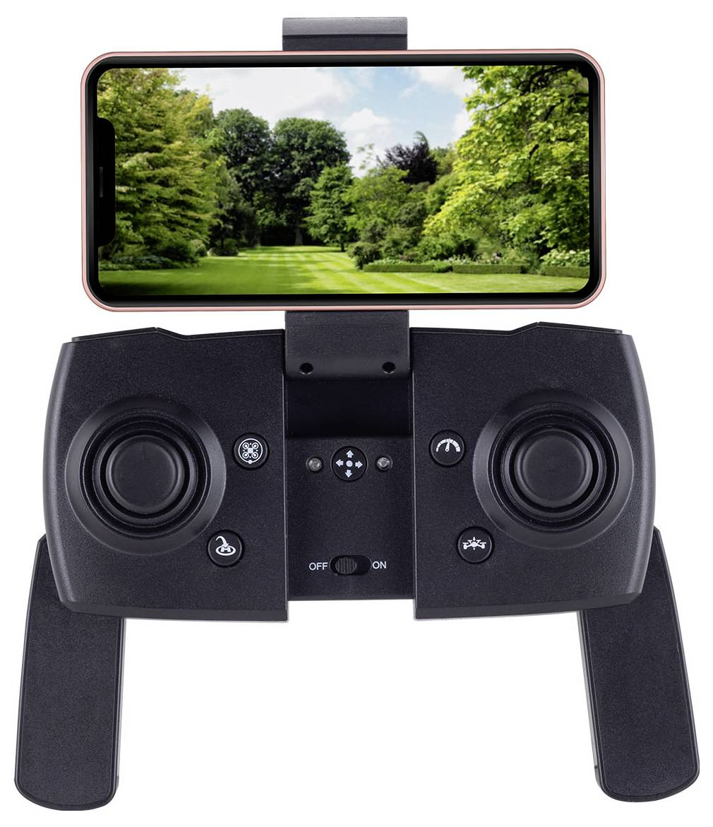 A handheld remote control device with a smartphone attached, displaying a green park scene on the screen, suggesting remote viewing.