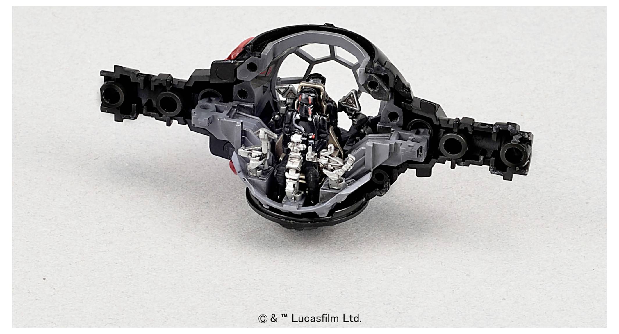 Close-up of the interior of a spaceship cockpit model with detailed seat and control panel designs.