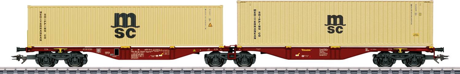 Two connected freight train cars carrying beige shipping containers marked 'MSC' on railroad tracks.