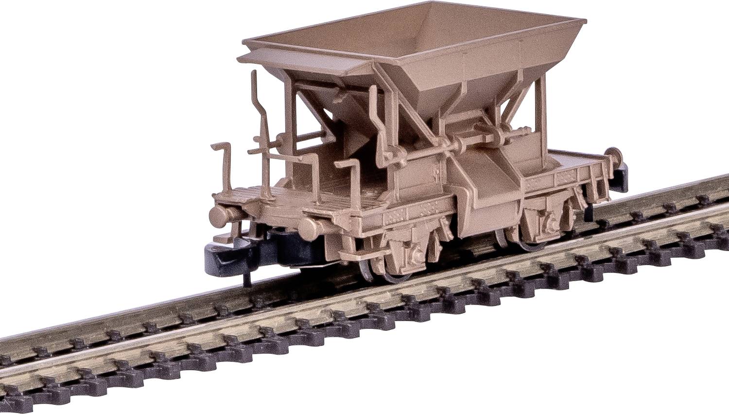 A miniature model of a brown hopper train on a section of track, showing detailed rail supports and wheel mechanisms.