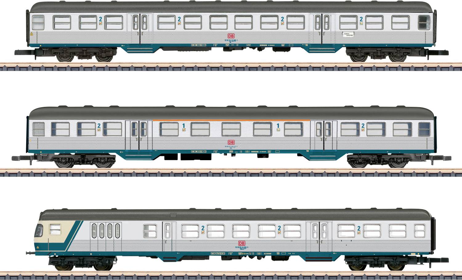 Three train cars are shown: two passenger cars and one control car with streamlined front, all featuring a silver and teal color scheme.