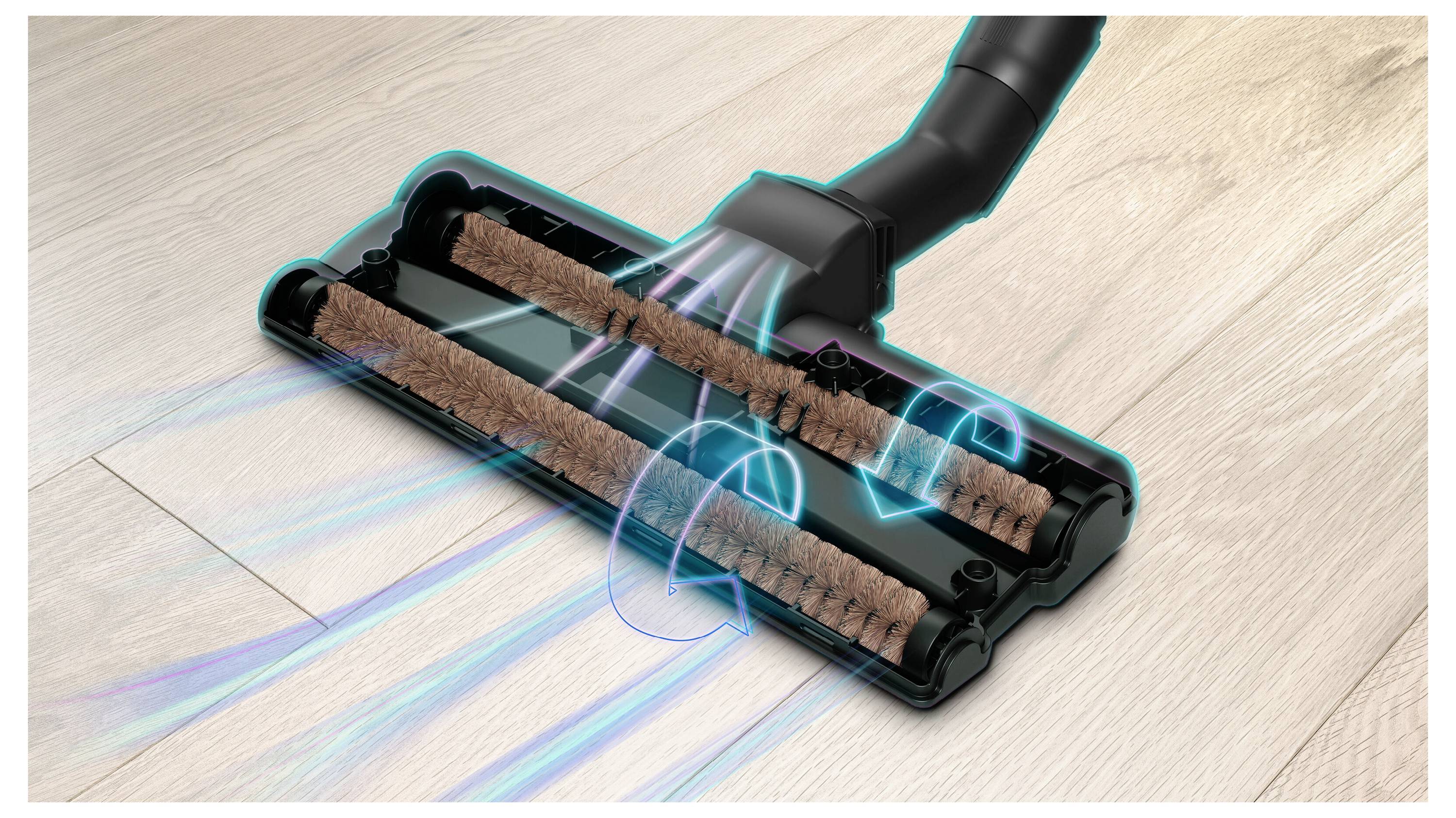 Vacuum cleaner brush head on a wooden floor, showing airflow and rotating bristles, illustrating its mechanism for picking up dust.