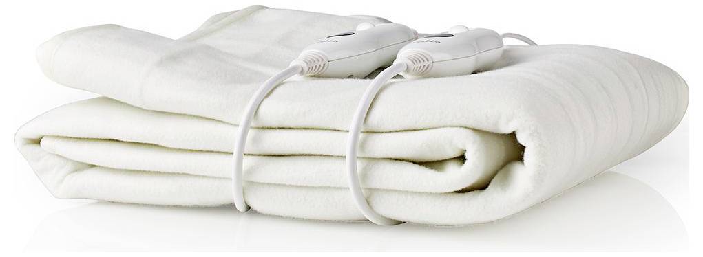 White electric blanket folded neatly with dual controls on top, resting on a white surface.