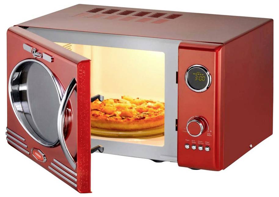 A red microwave oven with an open door, showing a pizza inside, timer display reading '3:00', and control knobs below.
