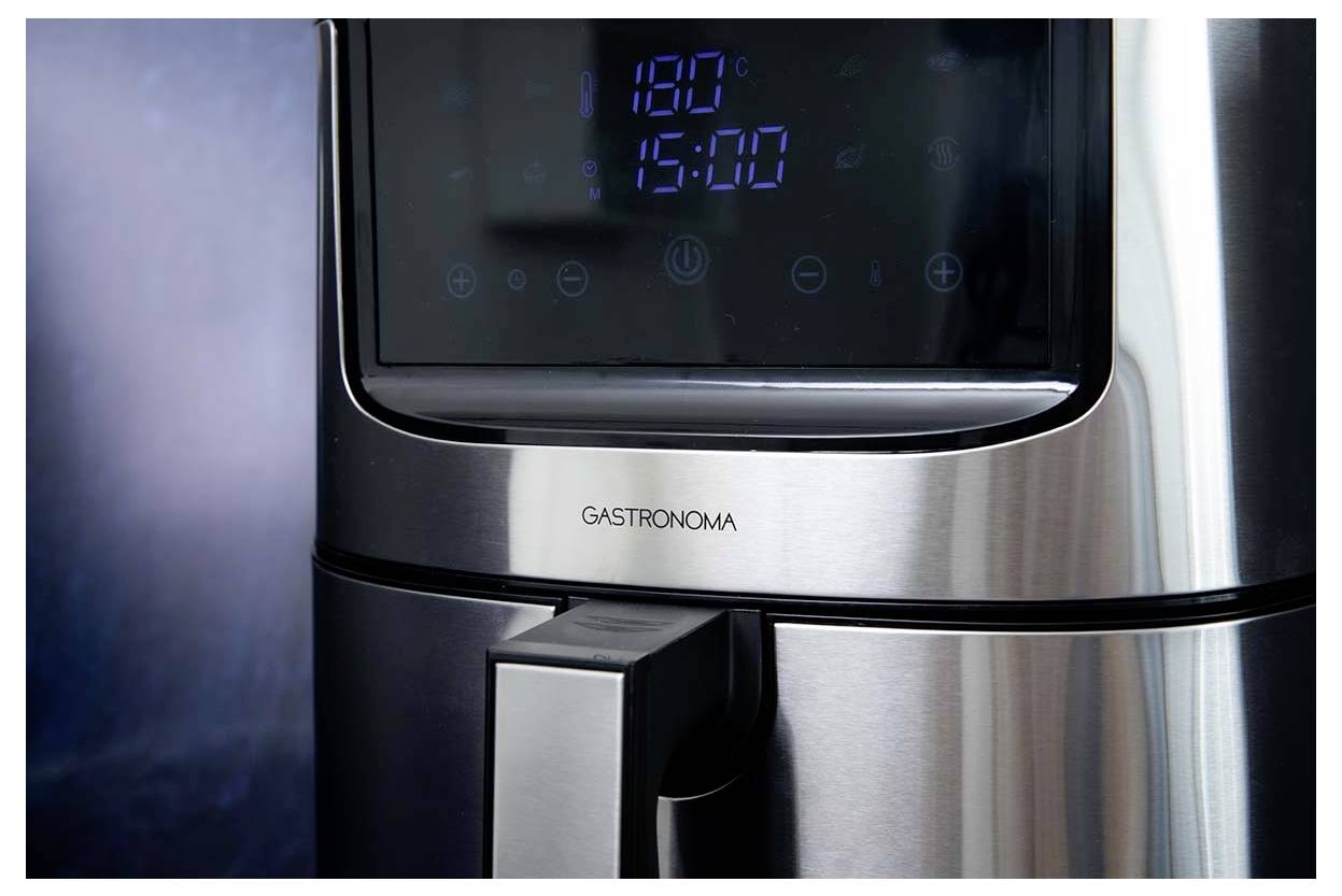 A stainless steel air fryer with a digital display showing '180°C' and '15:00'. The brand name 'Gastronoma' is visible on the front.