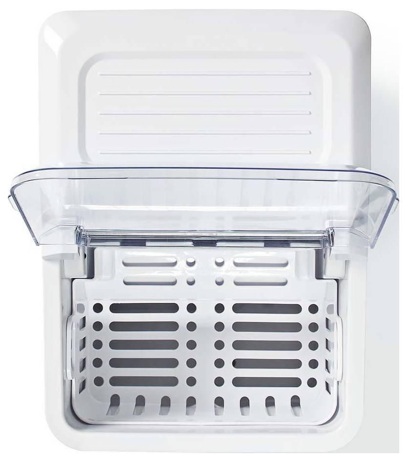 Ice maker bin: top-down view of a white ice maker's open compartment with a clear lid and perforated basket for storing ice cubes.