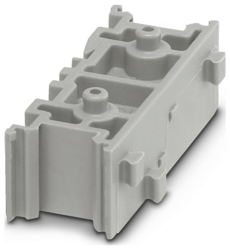A gray, rectangular plastic component with small protrusions and recessed areas, resembling an industrial or mechanical part.