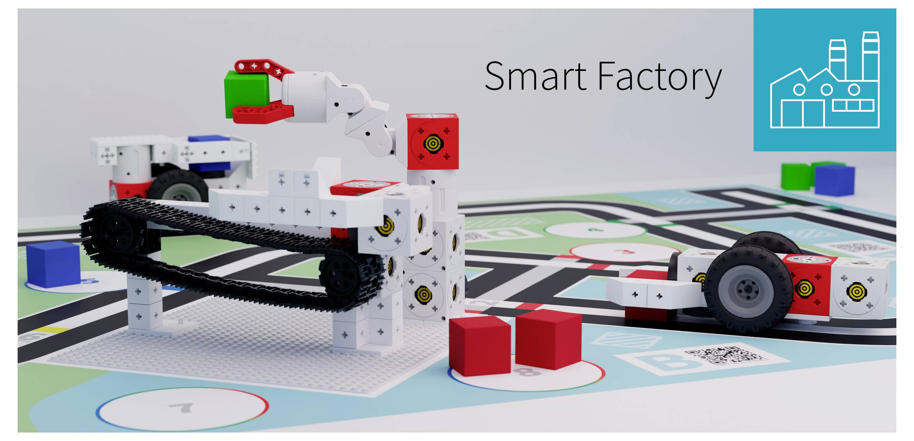 'Smart Factory' robotic assembly models with colored blocks on a pattern grid.