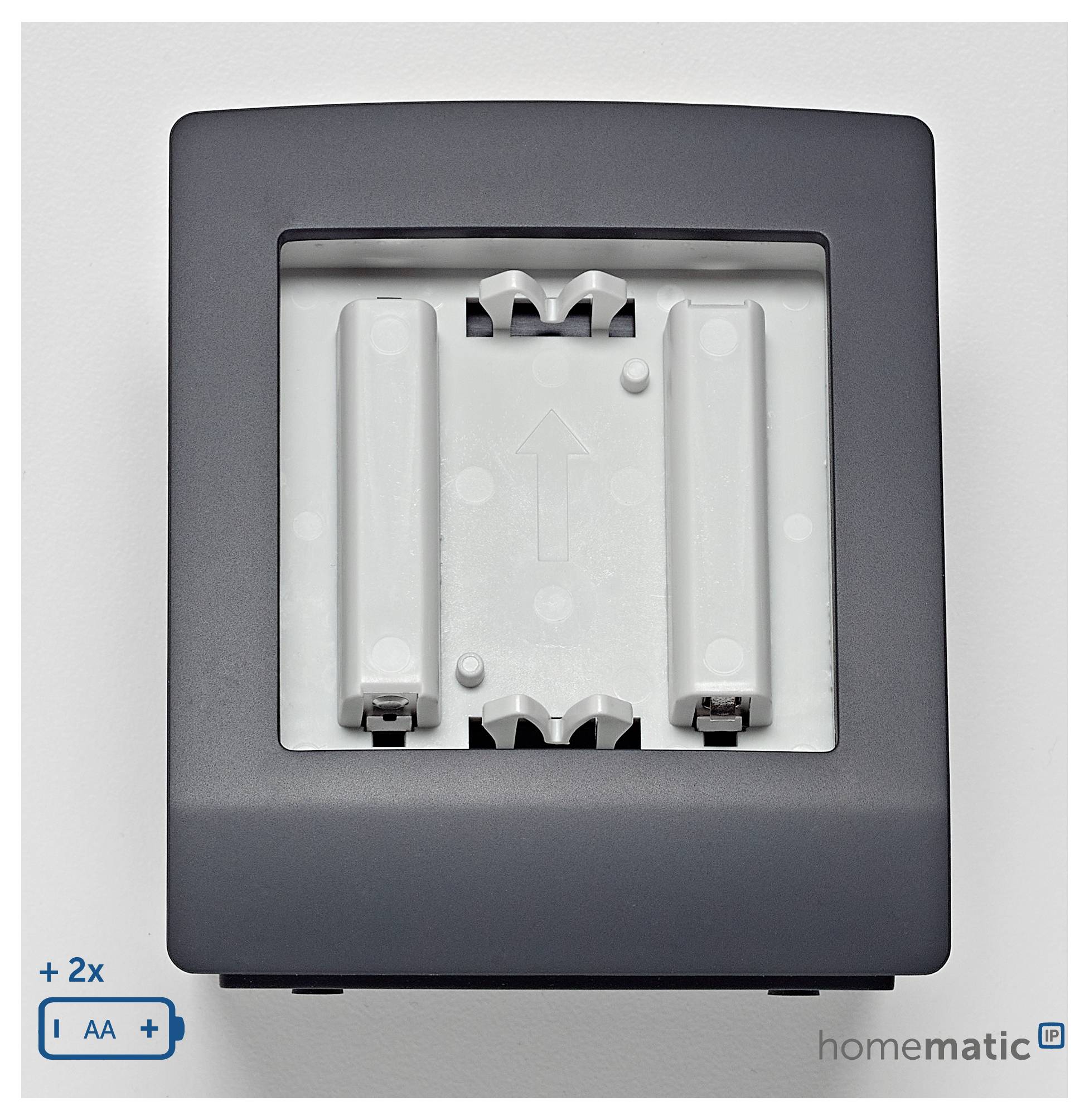 A wall-mounted, battery-operated device housing with slots for two AA batteries, showing arrow for battery alignment, brand 'homematic.'