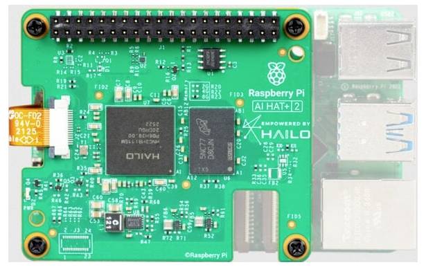 A Raspberry Pi AI HAT with various electronic components, connectors, and a Hailo chip for enhanced processing capabilities.