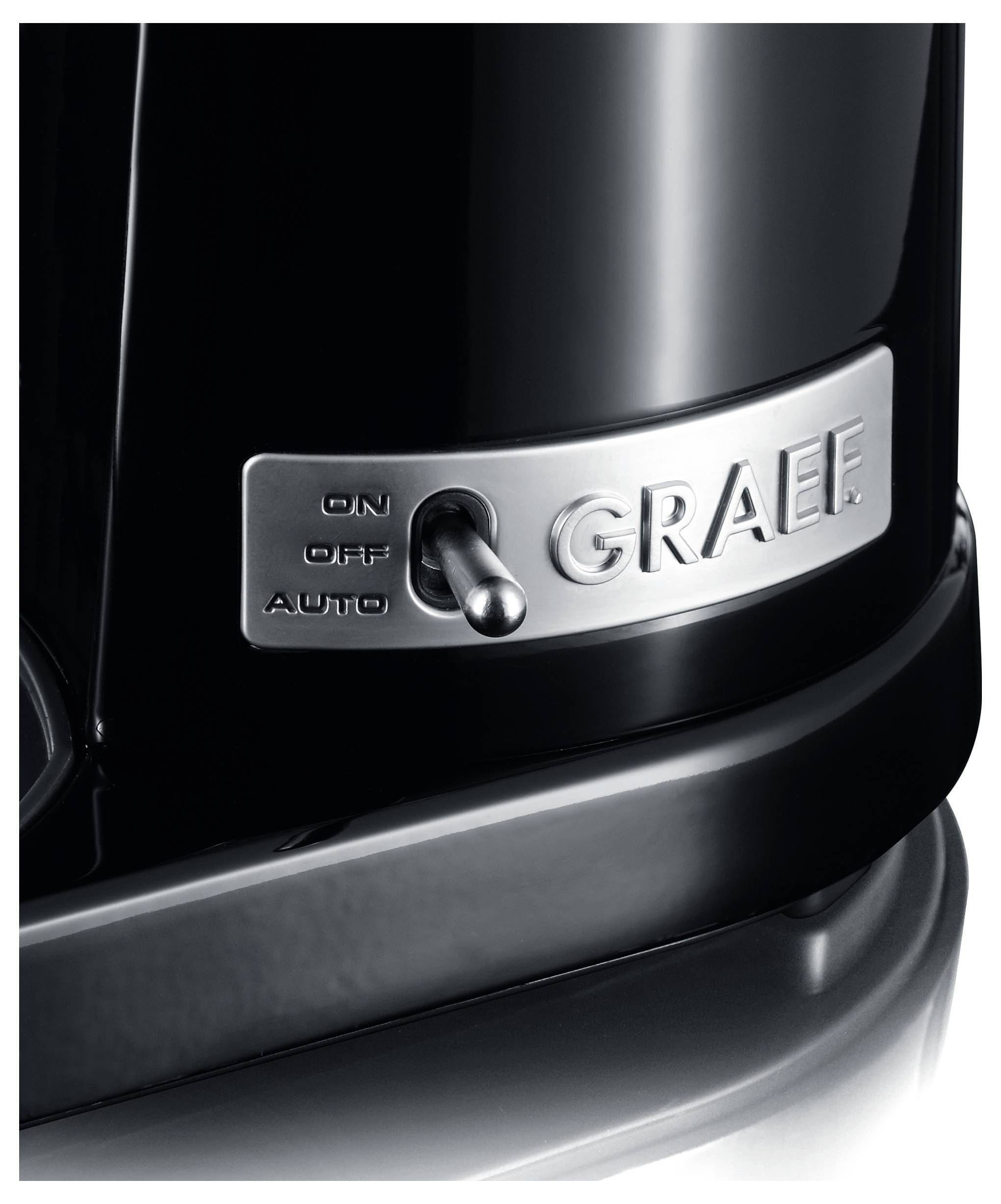 A close-up of a black appliance with a switch labeled 'ON', 'OFF', 'AUTO' on a metallic plate with 'GRAEF' logo.