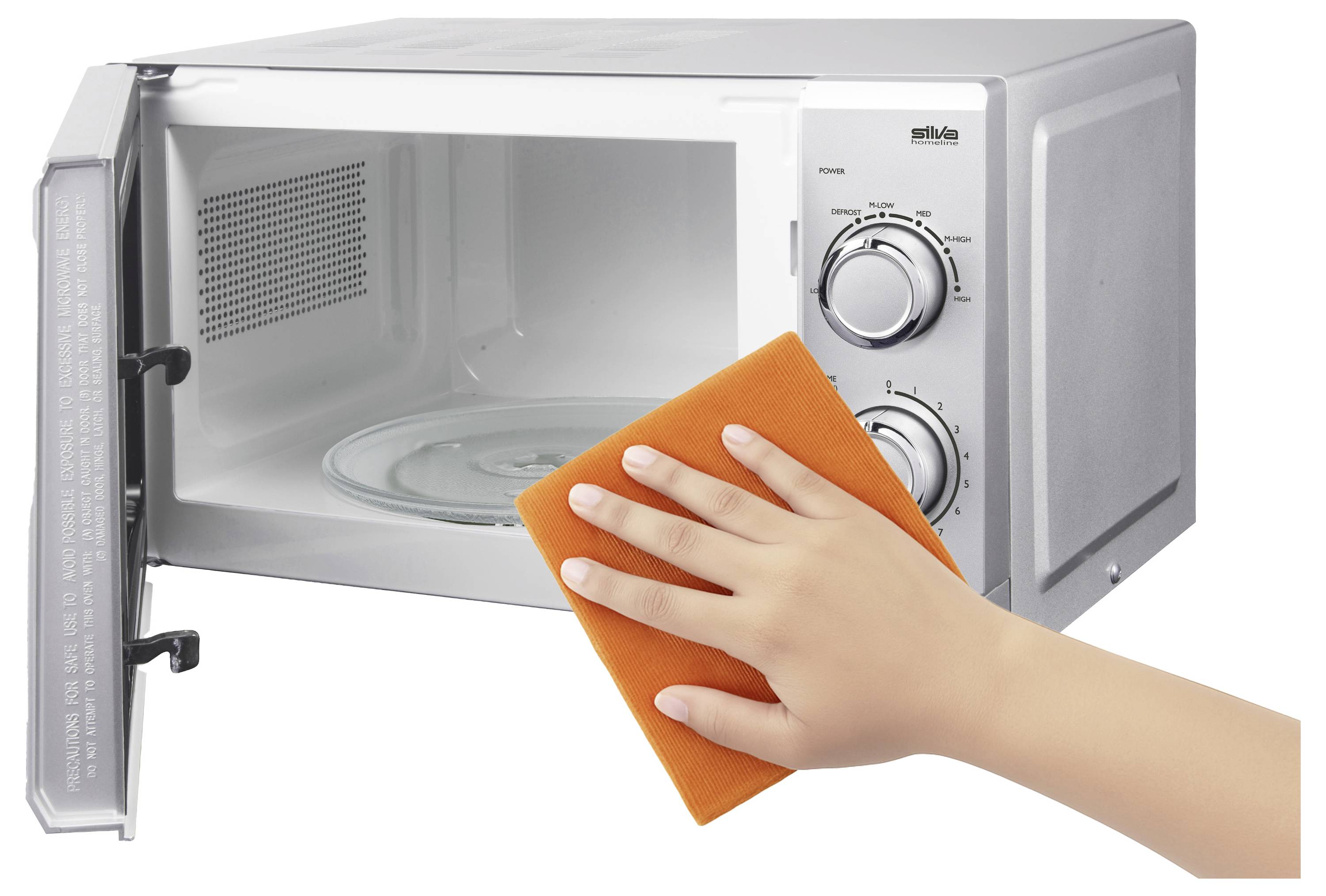A hand cleans the inside of an open microwave with an orange cloth, highlighting the importance of maintaining kitchen appliance hygiene.